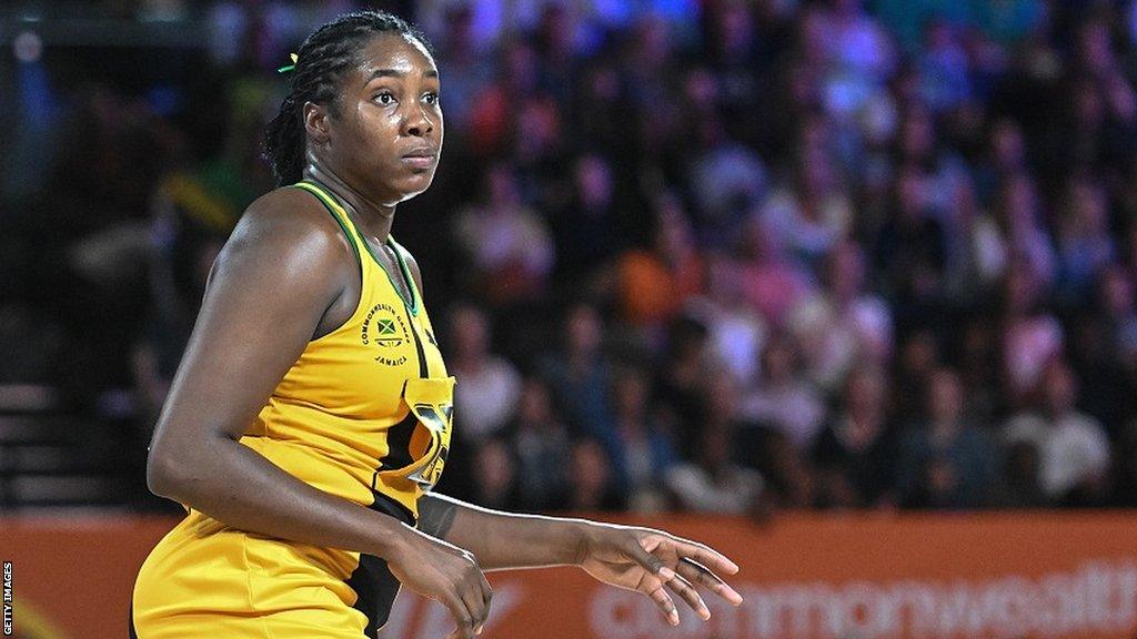 Jhaniele Fowler in yellow playing for Jamaica at the 2022 Commonwealth Games in Birmingham