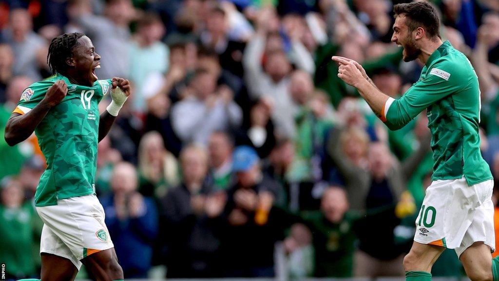 Michael Obafemi celebrates with Troy Parrott after scoring against Scotland in June