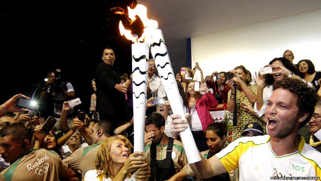 The Olympic 2016 torch is handed over