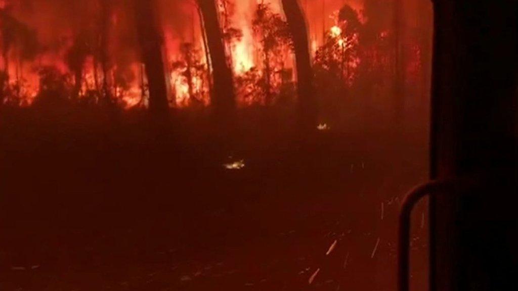 Fire truck overrun by bushfire flames