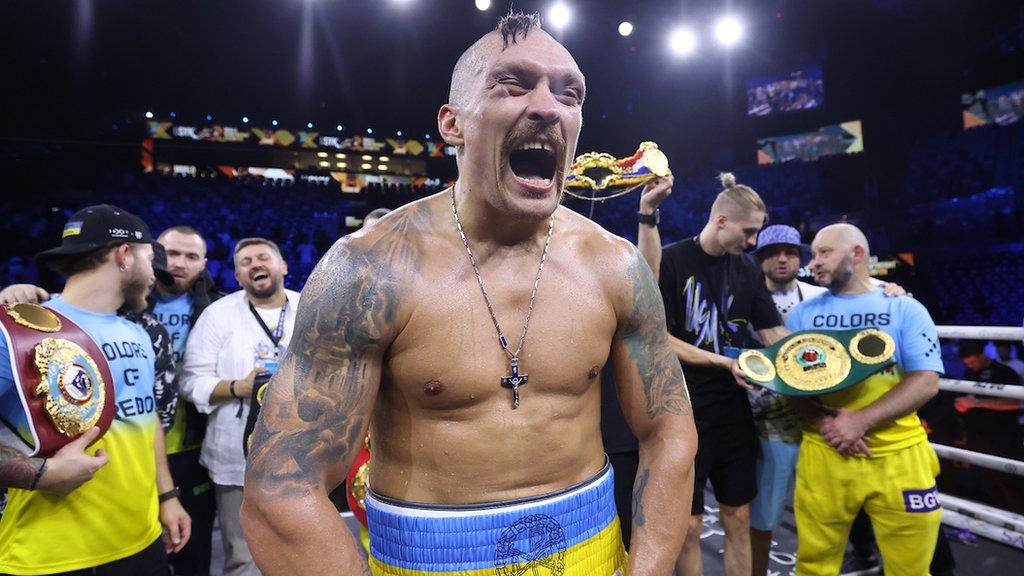 Oleksandr Usyk celebrates