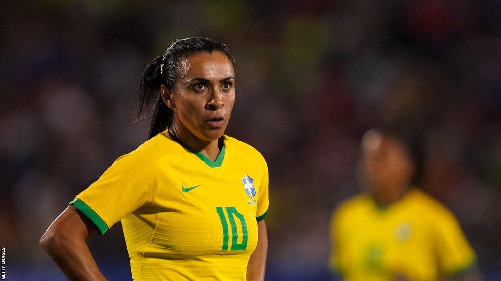 Brazil striker Marta rests her hands on her hips