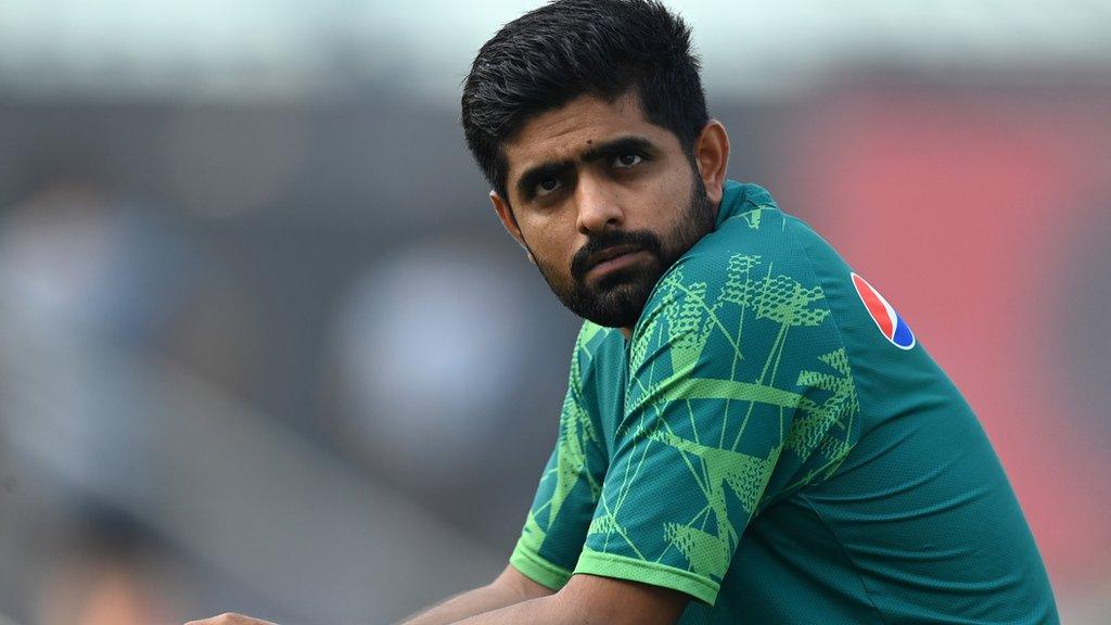 Babar Azam looks on