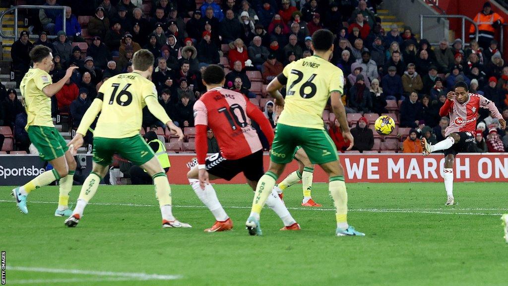 Kyle Walker-Peters (far right) strikes the ball to score for Southampton