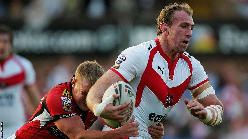 Luke Robinson of Salford tackles Nick Fozzard of St Helens during a Super League match in 2007