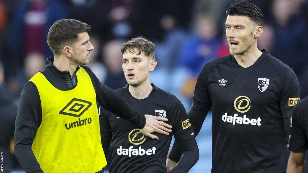 Wales and Bournemouth teammates Chris Mepham (left) and Kieffer Moore (right) with David Brooks (centre) after his first appearance for Bournemouth since his cancer treatment