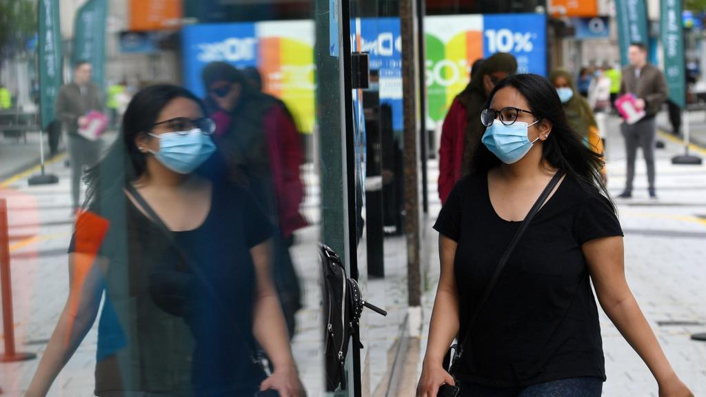 Woman wearing a mask in Cardiff city centre
