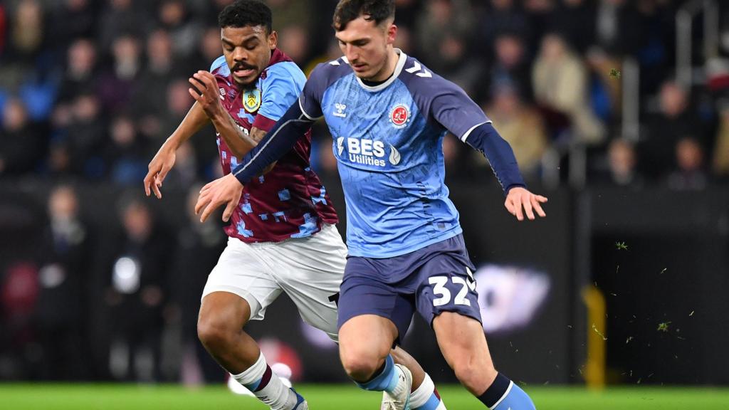 Burnley's Lyle Foster battles with Fleetwood Town's Josh Earl