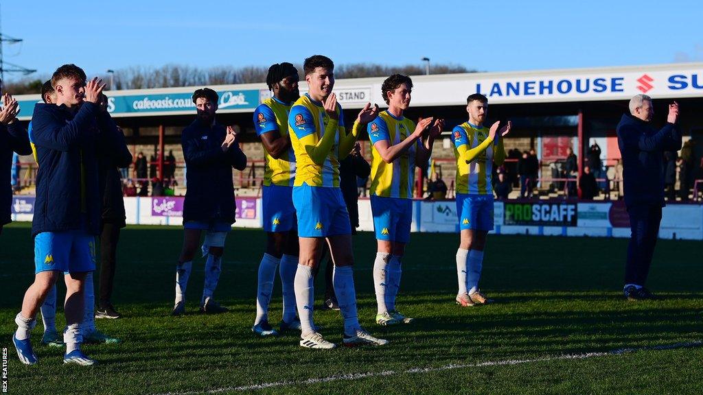 Torquay players applaud fans