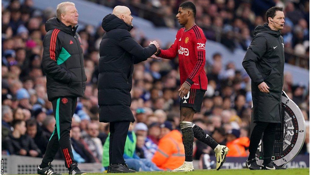 Erik ten Hag shakes hands with Marcus Rashford