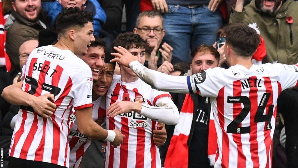 Sunderland players celebrate scoring a goal against Birmingham City