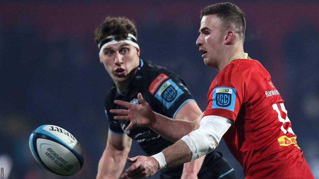 Shane Daly distributes the ball for Munster in the first half