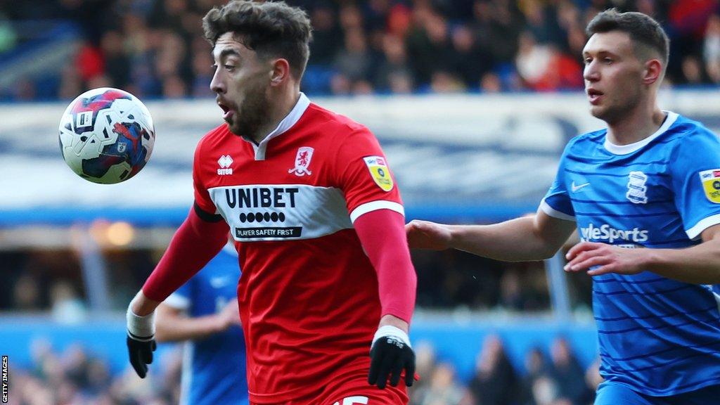 Matt Crooks looks to control the ball with Krystian Bielik lurking behind