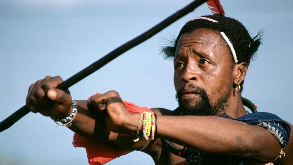 A king's warrior performing a dance during the Icwala festival