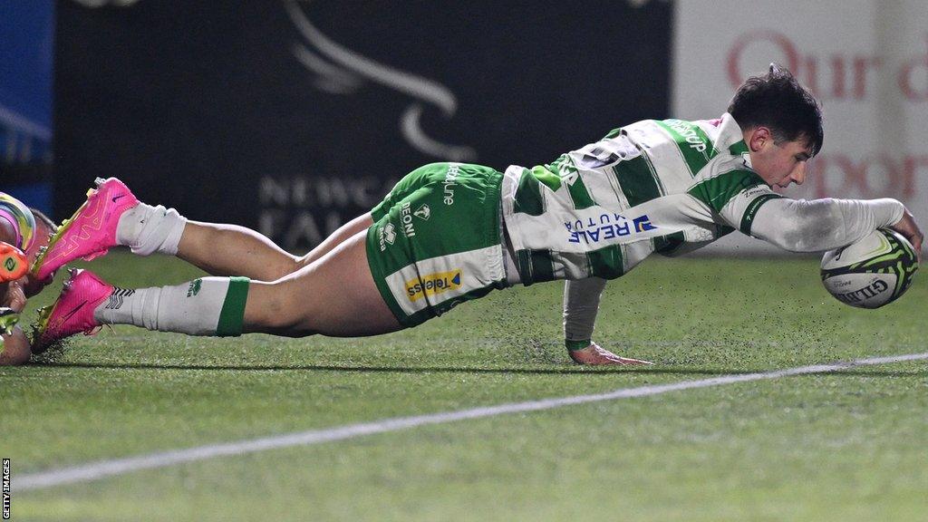 Benetton centre Tommaso Menoncello stretches to score the first of his two tries against Newcastle Falcons