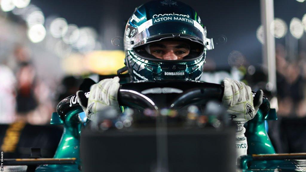 Lance Stroll stepping out of his Aston Martin Formula 1 race car at the Qatar Grand Prix