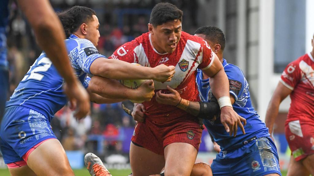 Tonga captain Jason Taumalolo tackled by Samoa