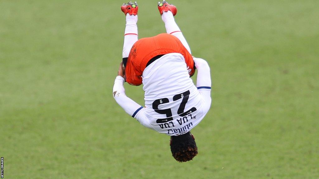 Kazenga Lualua does a flip celebration after scoring for Luton Town