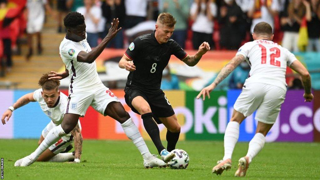 Germany midfielder Toni Kroos is pressed by three England players during their Euro 2020 last-16 tie at Wembley