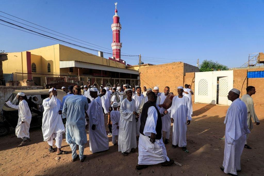 Muslim worshippers greet each other at al-Hara al-Rabaa Mosque in the Juraif Gharb neighbourhood of Khartoum