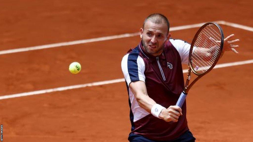 Dan Evans returns a ball