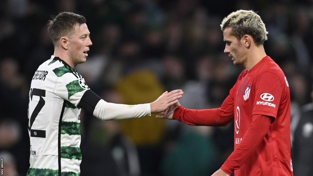 Callum McGregor exchanges a handshake with Antoine Griezmann