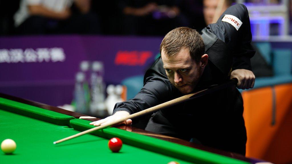 Mark Allen plays a shot at the 2023-24 Champions of Champions