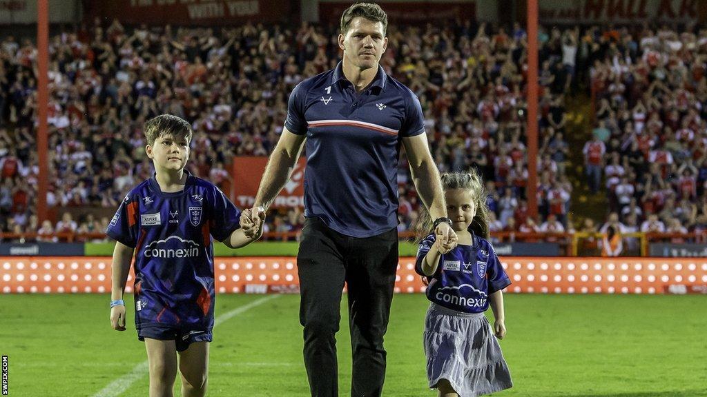 Lachlan Coote with his children