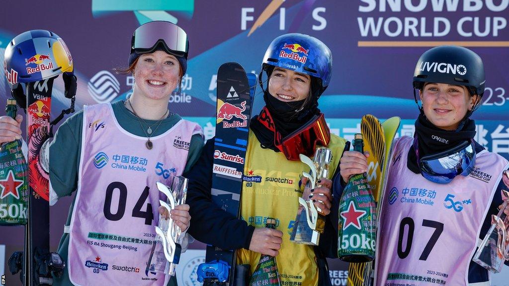 Great Britain's Kirsty Muir celebrates with winner Mathilde Gremaud and third-placed Flora Tabanelli