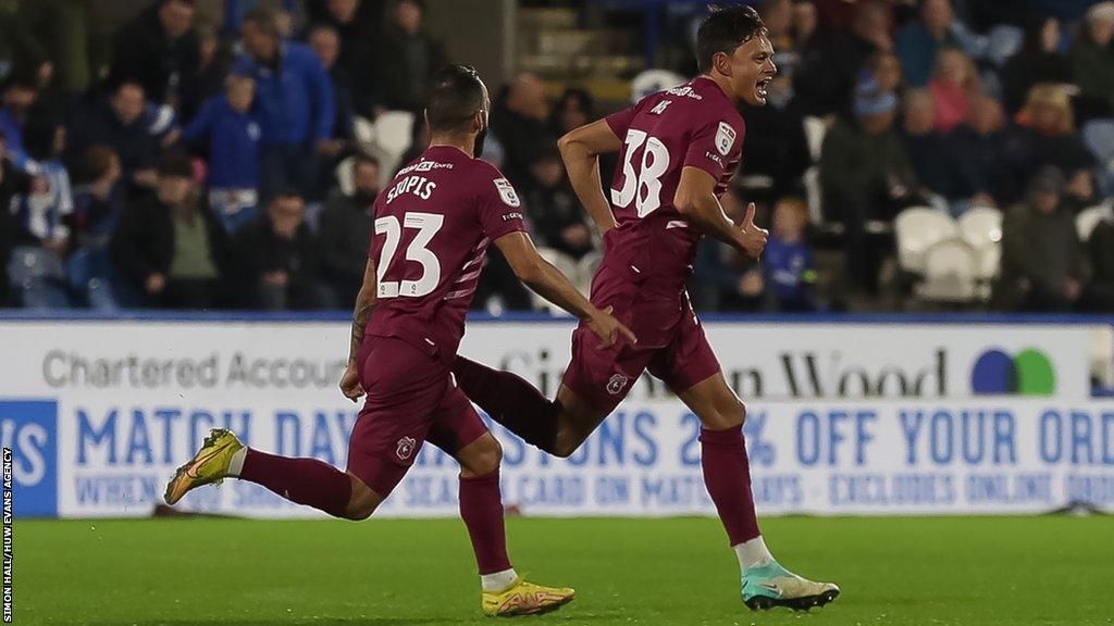 Perry Ng celebrates his goal at Huddersfield with Manolis Siopis