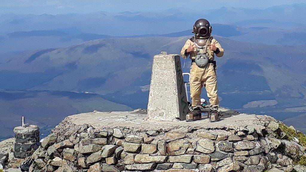 Diver on summit of Ben Nevis