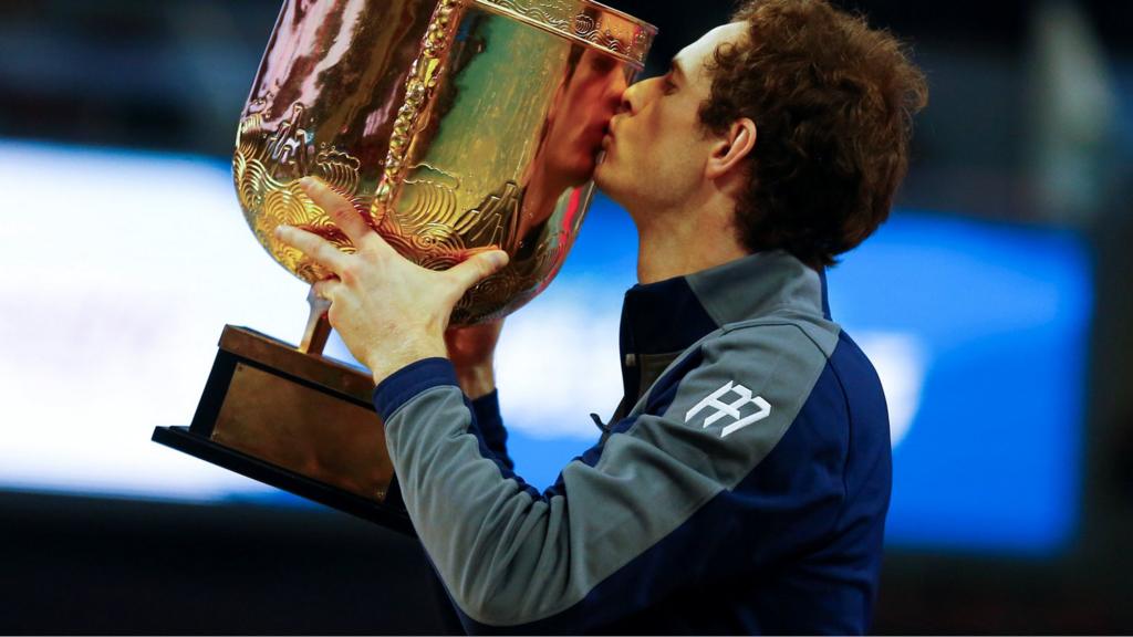 Andy Murray holds his trophy