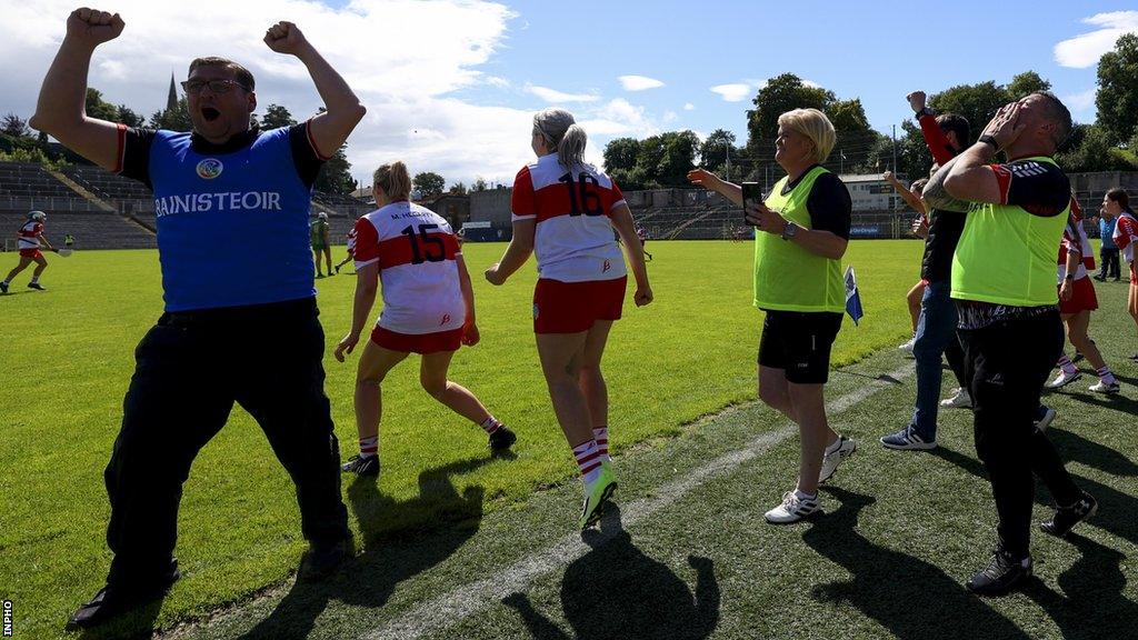 PJ O'Mullan and the Derry bench celebrate after the team's triumph at Clones