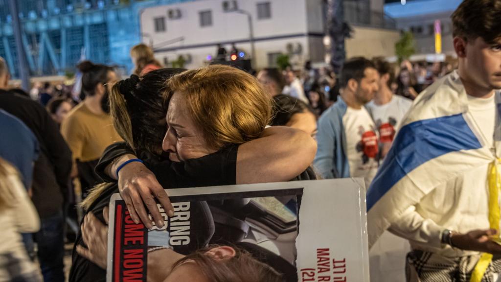 People react during a rally in Tel Aviv organised by the Bring Them Home Now association to support families of kidnapped people