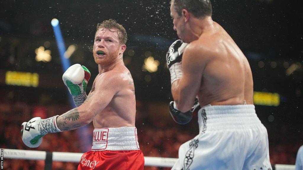 Saul 'Canelo' Alvarez throws a punch at Gennady Golovkin in their 2022 bout