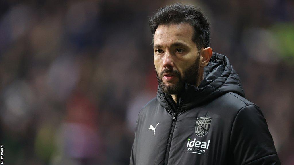 West Brom head coach Carlos Corberan watches on from the dugout during a game