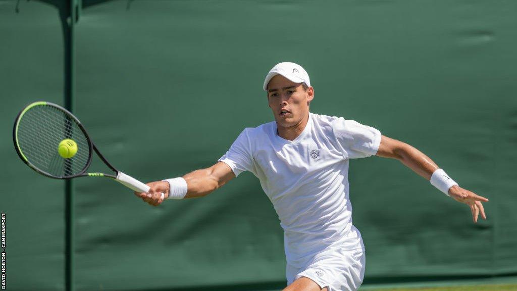 Charles Broom playing a forehand