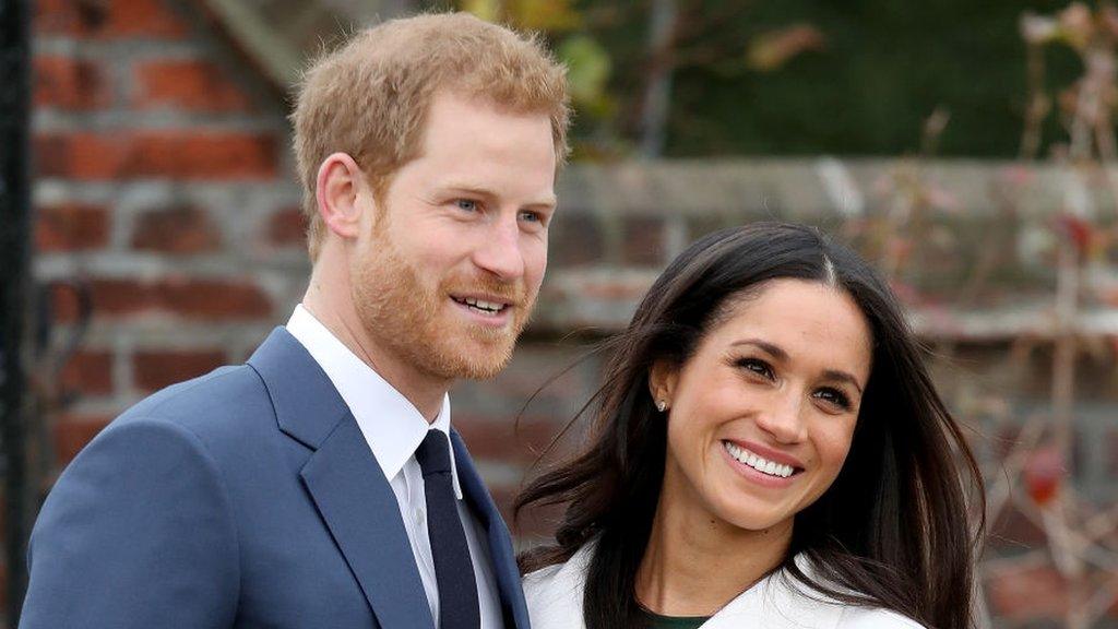 Harry and Meghan smiling