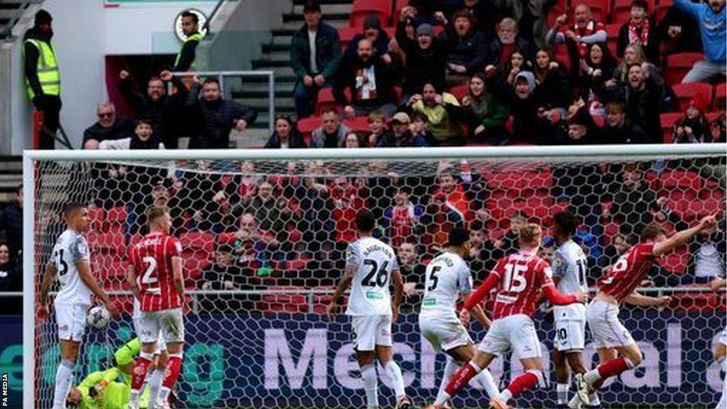 Rob Dickie runs away to celebrate his third goal in his last 10 appearances