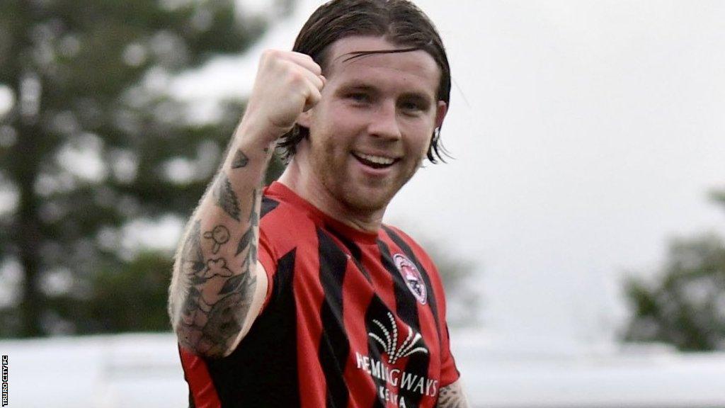 Tyler Harvey celebrates scoring for Truro City