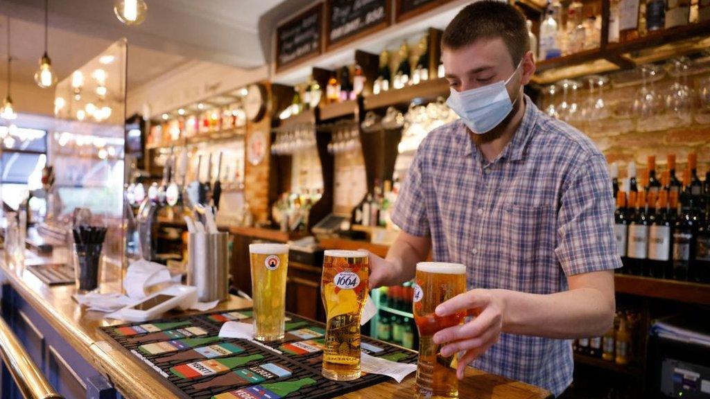 Barman serving pints