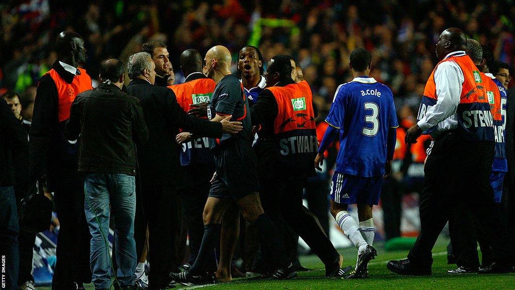 Chelsea striker Didier Drogba shouts at referee Tom Ovrebo as he is escorted off the pitch following Champions League semi-final exit against Barcelona in 2009