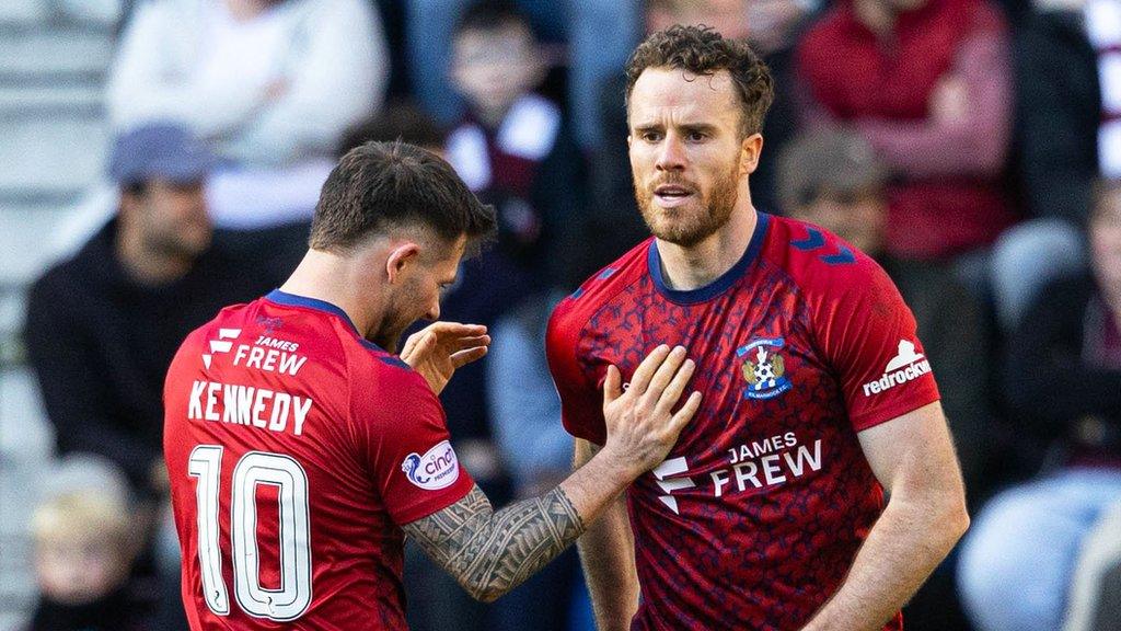 Marley Watkins celebrates his all-important equaliser with team-mate Matty Kennedy