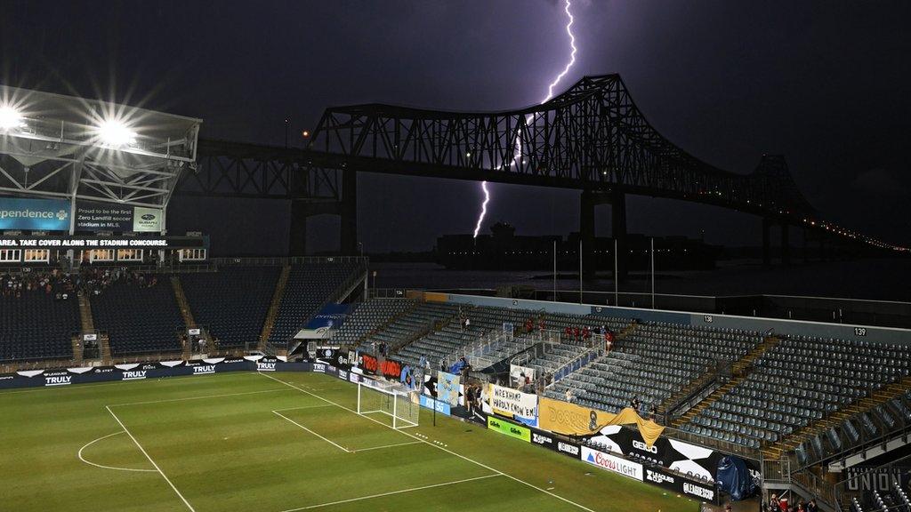 Lighting strikes near Subaru Park while the game between Philadelphia Union II and Wrexham is delayed due to the weather.