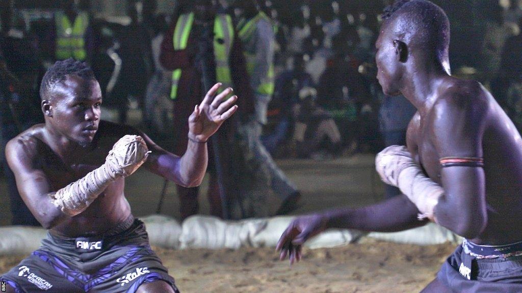 Fighters size each other up during a Dambe fight at the Emir Ado Bayero Dambe Championship