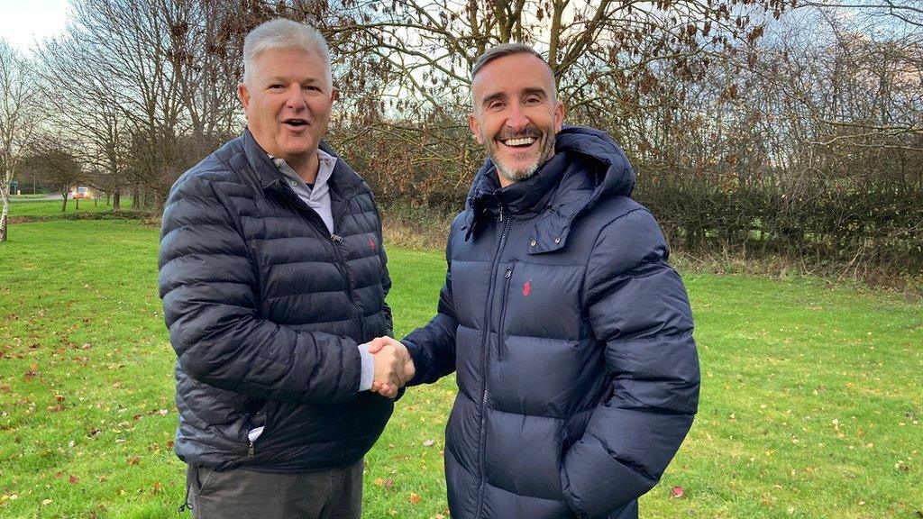 Stennard Harrison, managing director of Marsten Developments (left), shakes hands with Worcester City owner Simon Lancaster at the proposed new Fernhill Heath home