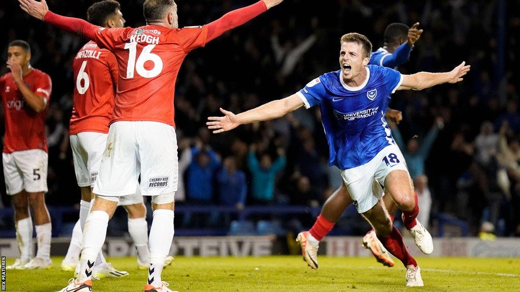 Portsmouth defender Conor Shaughnessy scores and celebrates against Wycombe Wanderers at Fratton Park