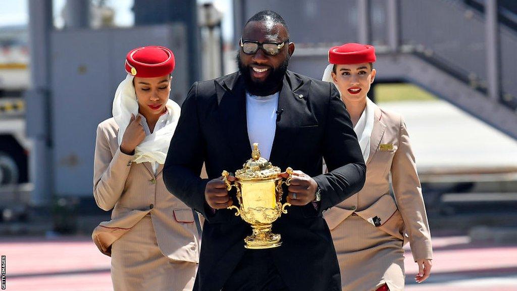 Former South Africa prop Tendai Mtawarira delivers the Williams Webb Ellis trophy to France back in March