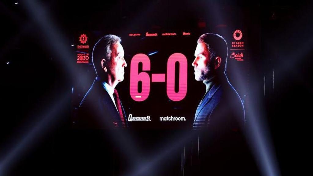 Image of Frank Warren and Eddie Hearn facing off, with 6-0 in the middle