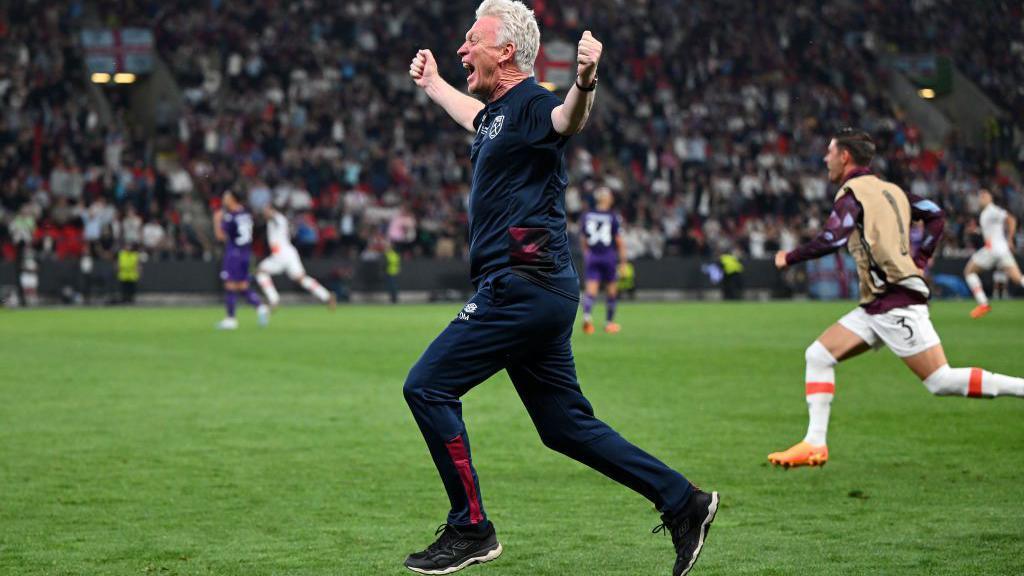 Moyes runs on the pitch, arms outstretched, after West Ham's win over Fiorentina in the 2023 Europa Conference League final